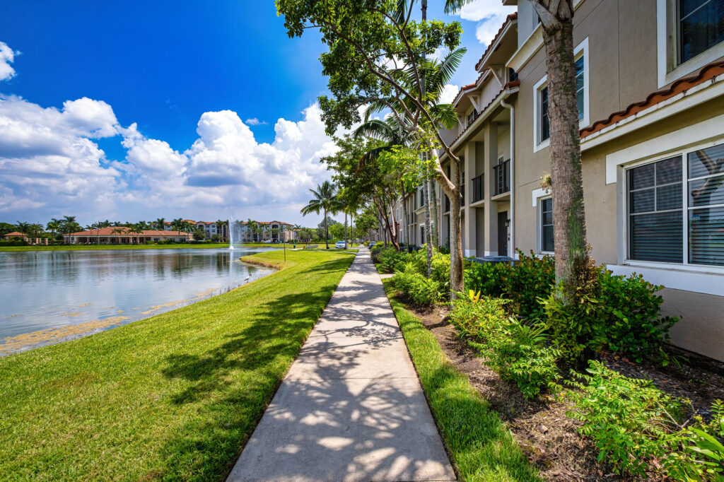 Landscaped walking path by a pond